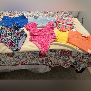 bundle two tank tops, overall dress, three bathing suits and two tank tops